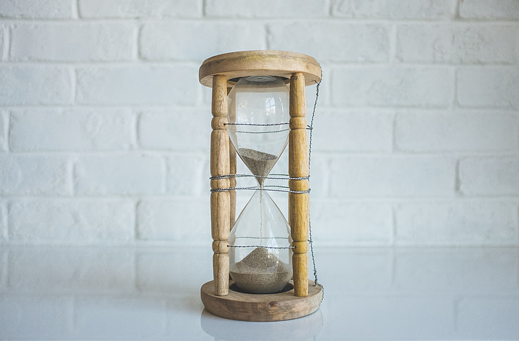 brown wooden frame hour glass