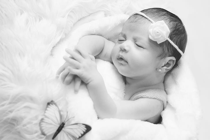 grayscale photo of baby sleeping