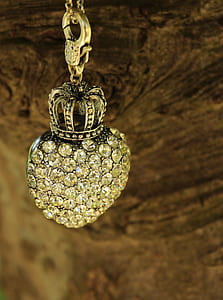 gold-colored and clear gemstone pendant necklace