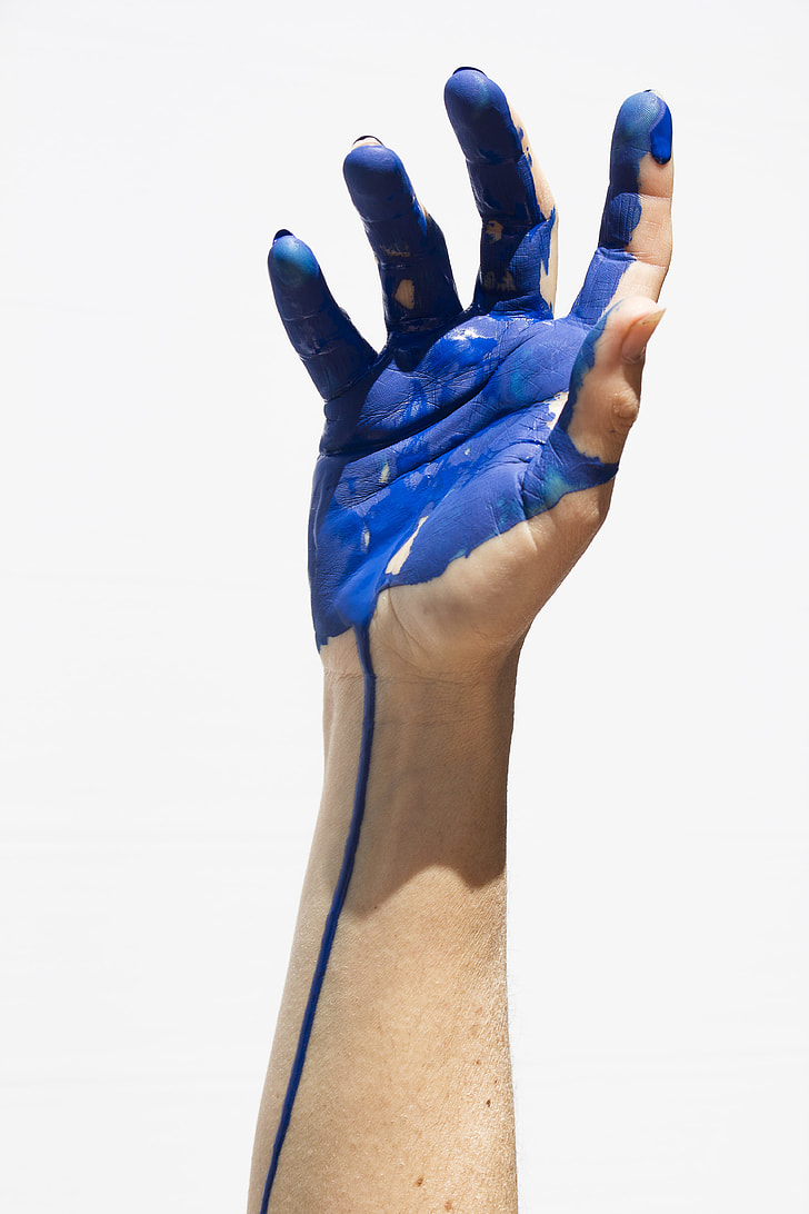 right arm with blue paint