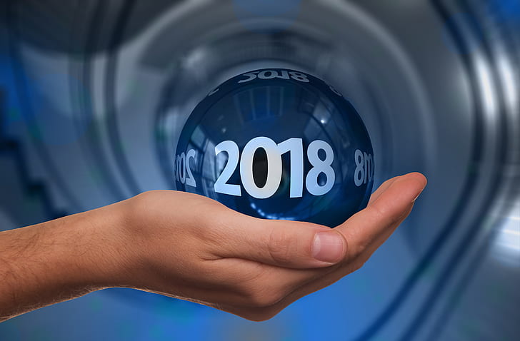 person holding 2018 blue ball
