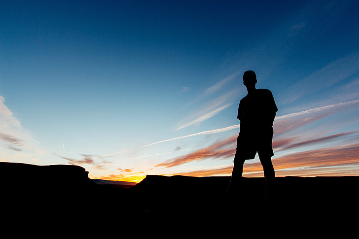 man silhouette during sunrise
