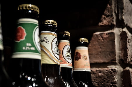 closeup photo of assorted-brands beer bottles