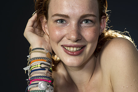 woman wearing assorted-color bracelet