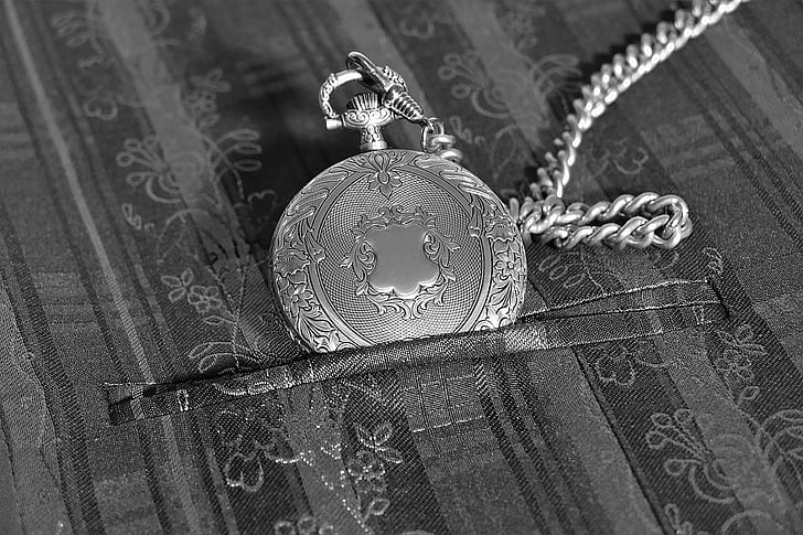 round pocket watch with chain-link necklace