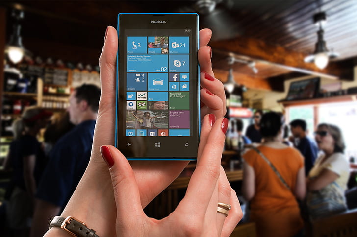 person showing Nokia Windows phone home screen
