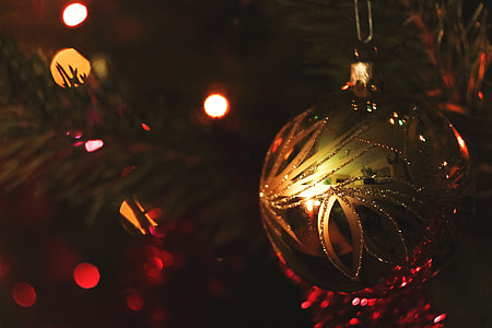 Closeup shot of gold ball decoration on a Christmas tree