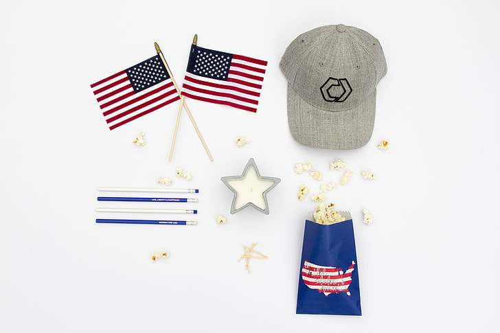 gray baseball cap with two U.S.A flags