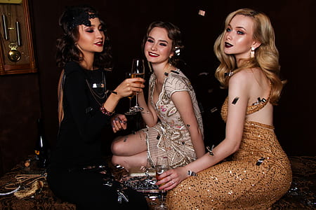 three women drinking champagne