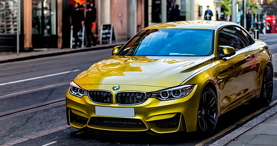 yellow BMW coupe