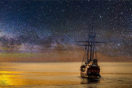painting of ship with stars on night sky