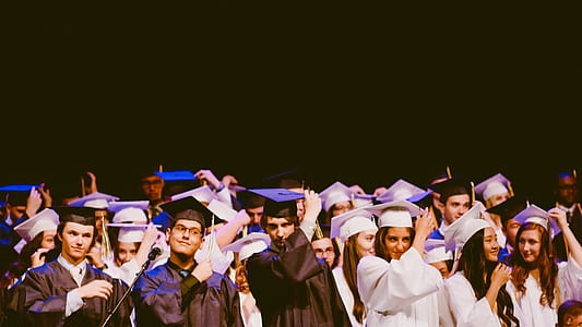 group of people wearing graduation gowns