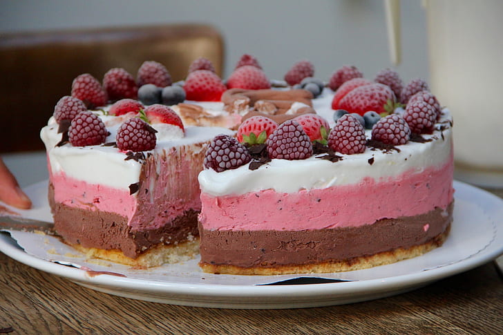 serve plate of cake with strawberry toppings