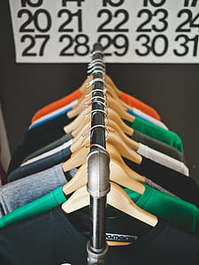 selective focus photography of hanged scoop neck shirts