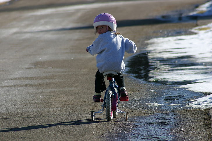 girl ride on bike on road