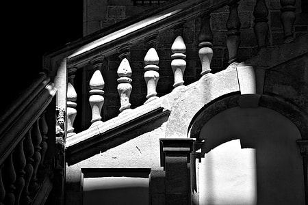 An image of an shadow-lit stone staircase, image captured in the Gothic Quarter, Barcelona