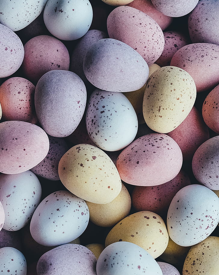 gray, pink, and yellow quail eggs