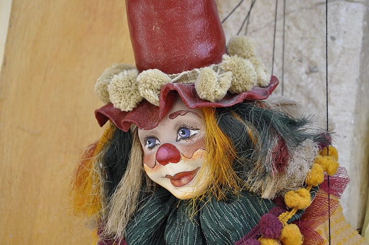 red and yellow clown figurine