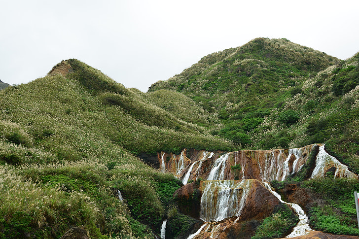 waterfalls near mountain