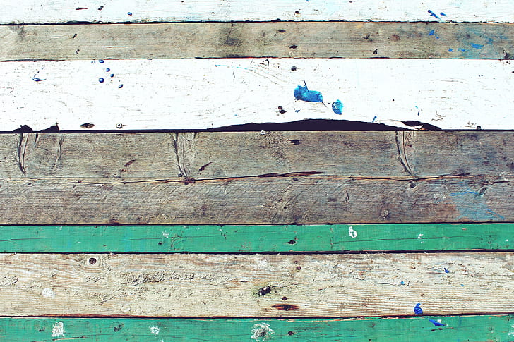 brown, white, and green wooden plank