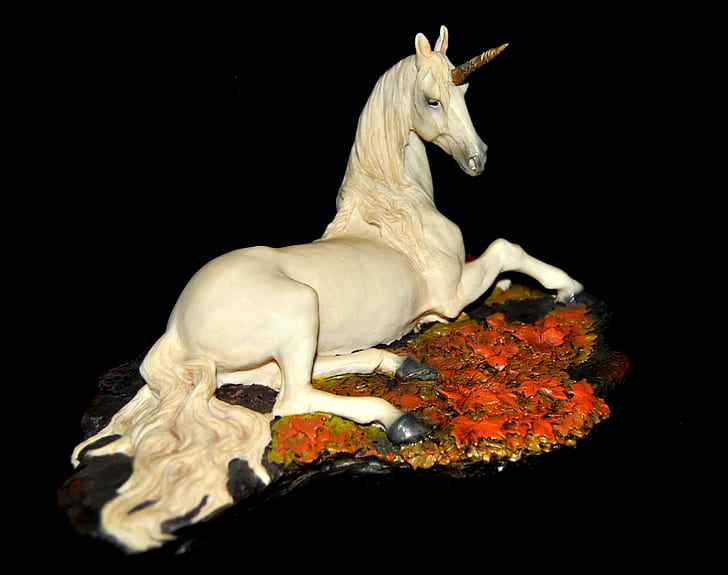 white ceramic unicorn figurine