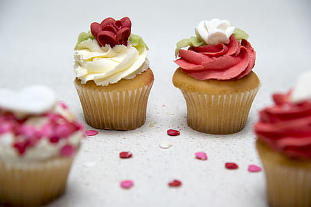 selective focus photography of two cupcakes