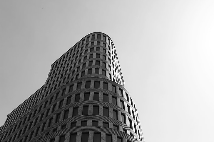 low angle grayscale photography of high raise building