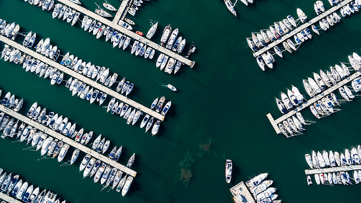 aerial photography of group of boats near dock during daytime