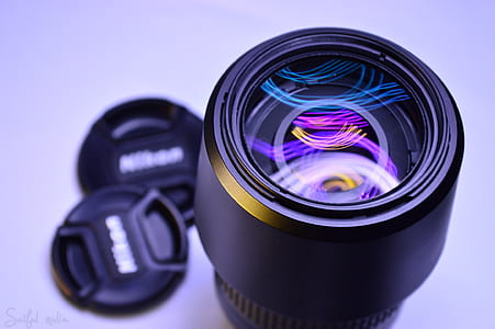 black Nikon DSLR camera lens