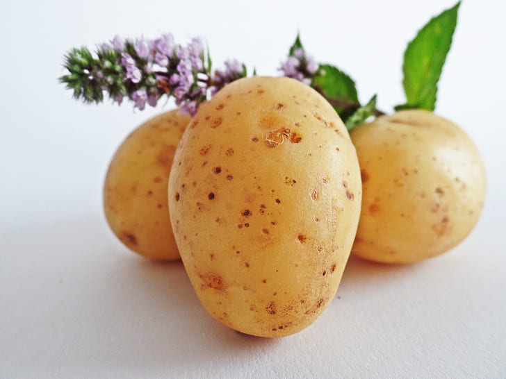 three brown potatoes