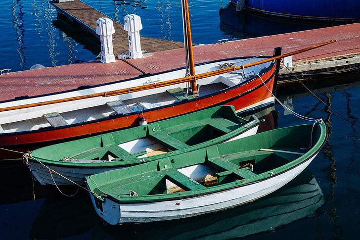 Two small boats sit in the harbour in Barcelona, Spain. Image captured with a Canon DSLR