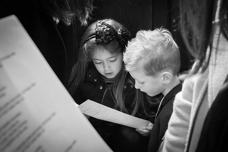 two girl and boy reading