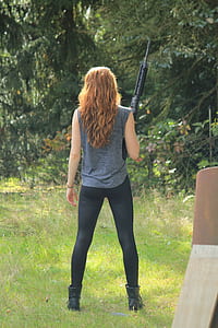woman holding rifle