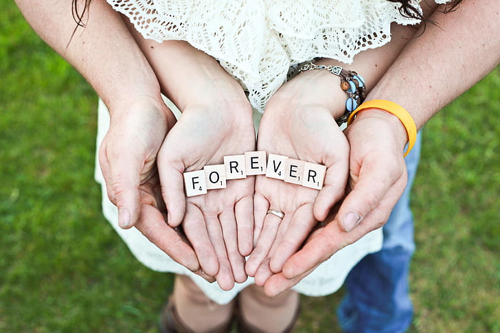 Forever scrabble letters on person hand