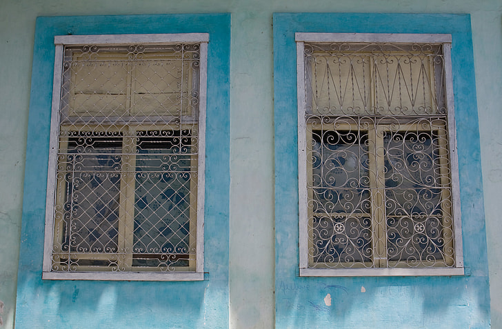 A pair of blue window details from Old Havana, Cuba. Image captured with a Canon DSLR