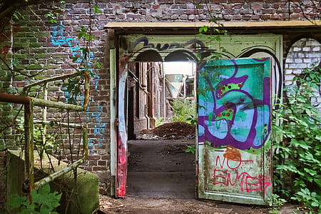 opened graffiti painted door