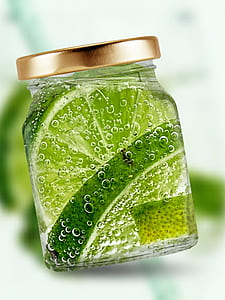 sliced of lemons inside of glass jar