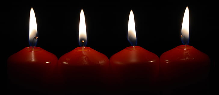 four red lighted candles
