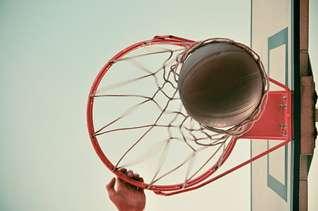 low angle photography of basketball on hoop