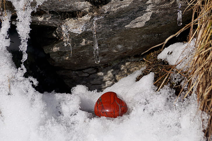heart-shape red stone surrounded by ice