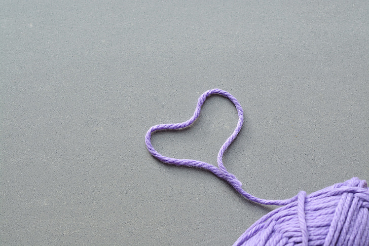 purple yarn formed heart