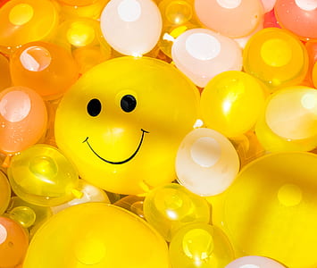 yellow and white water balloons