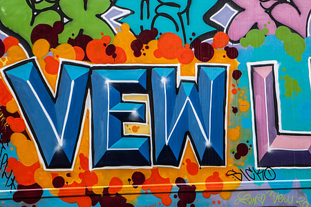 Close up shot of brightly coloured graffiti on the streets of Brooklyn, New York City