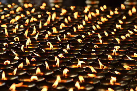 closeup photo of lighted candle lot