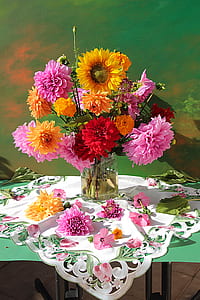 yellow sunflowers and red and pink Dahlias in clear vase painting