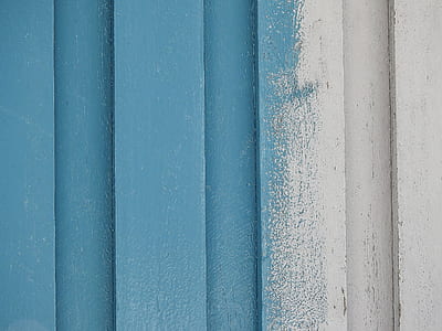 blue painted white wooden wall