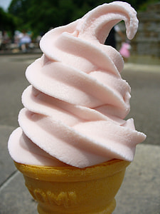 pink ice cream on brown cone