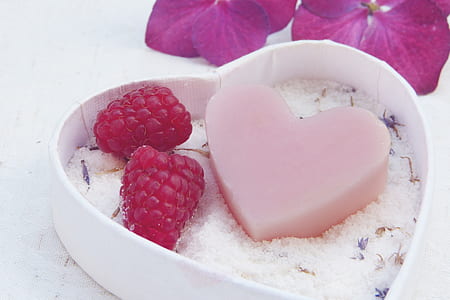 heart-shaped soap and strawberries on heart-shaped box