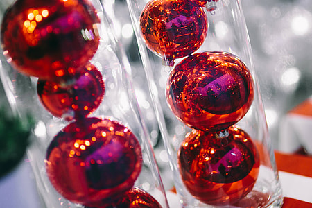 Red Christmas baubles packed in plastic tubes
