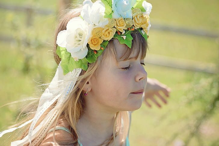 girl in blue spaghetti strap dress with white and yellow roses headband